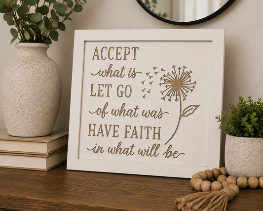 Accept What Is inspirational wood sign displayed on wooden console table with vase and greenery