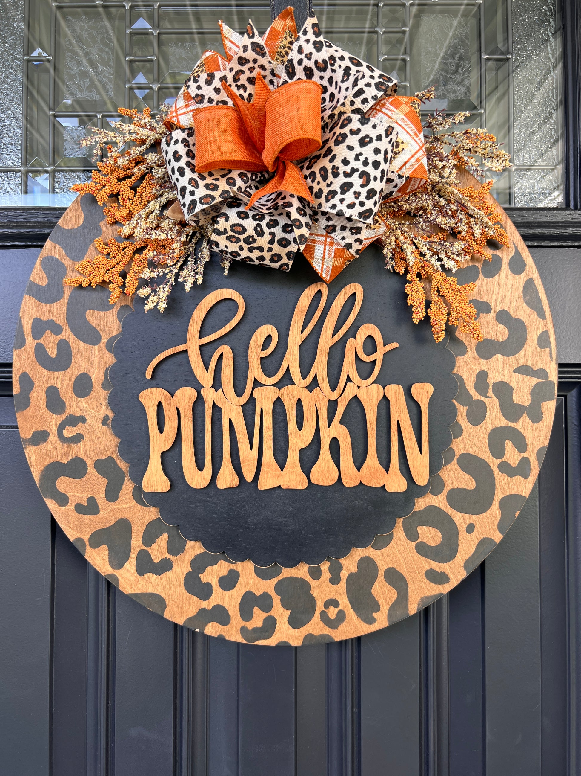 Hello Pumpkin leopard print door hanger full front view showing complete 18 inch round with layered leopard plaid and burlap bow