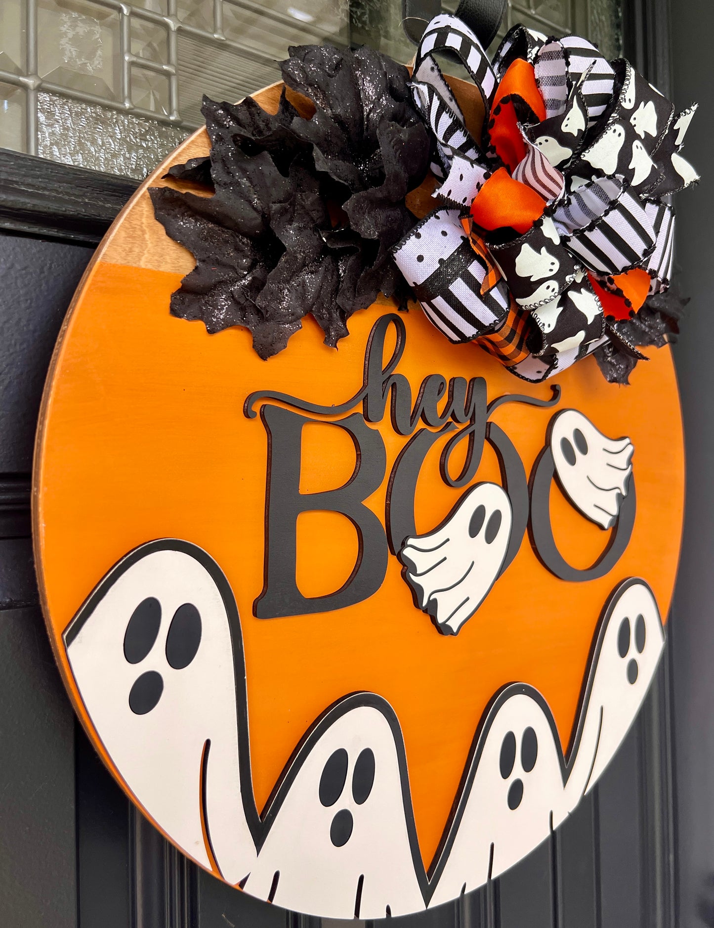 Hey BOO Halloween door hanger with black and orange bow close up