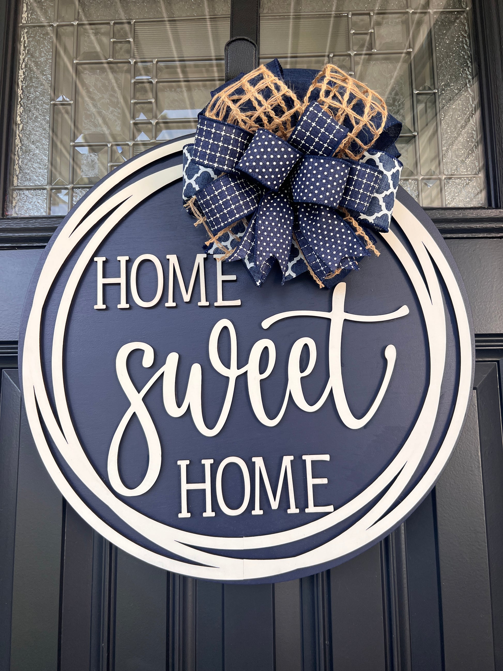 Home Sweet Home navy blue door hanger full front view showing complete 18 inch round with cream circle frame and layered navy bow