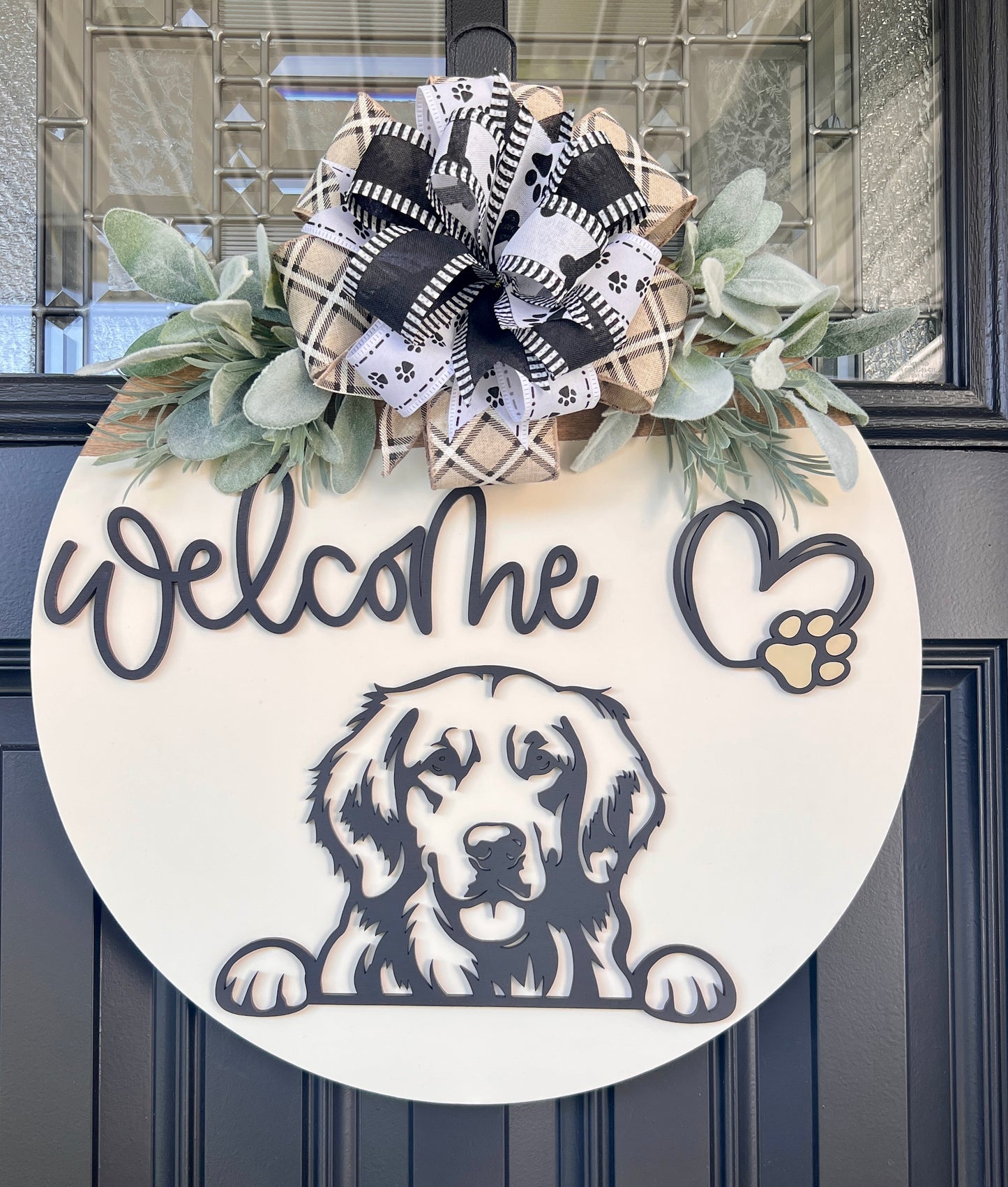 Custom dog breed wooden welcome sign with greenery and bow.