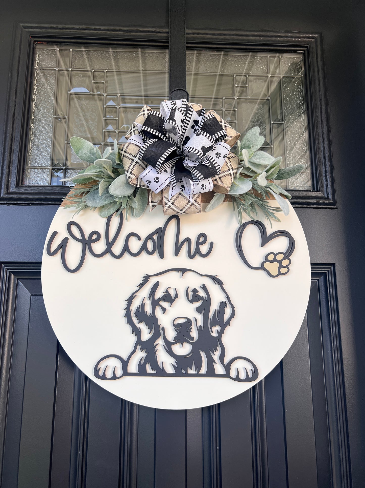 Custom dog breed wooden welcome sign with greenery and bow.