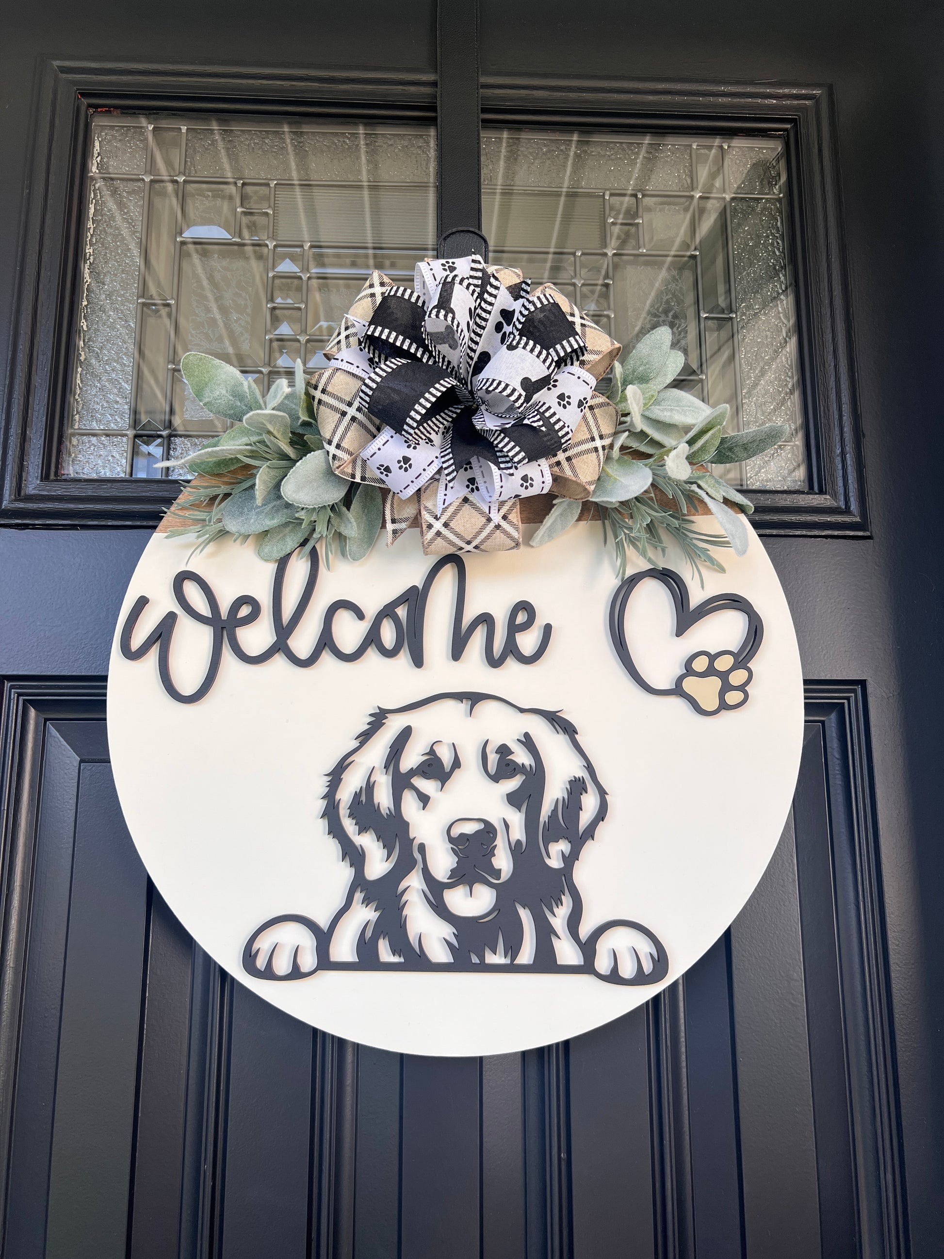 Custom dog breed wooden welcome sign with greenery and bow.