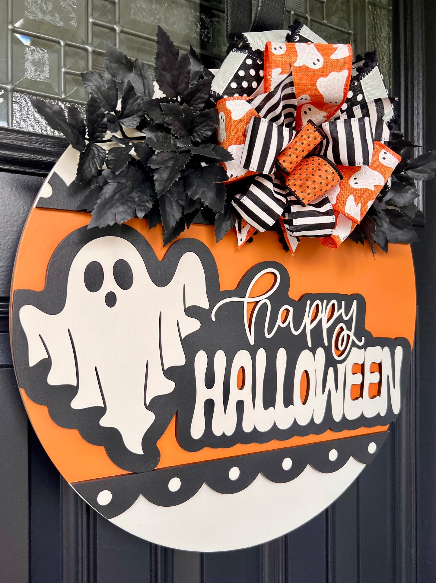 Happy Halloween ghost door hanger angled view showing depth of 3D layered design and dramatic black leaf sprays