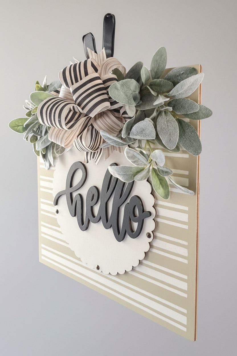 front door decor neutral tones with greenery and striped design