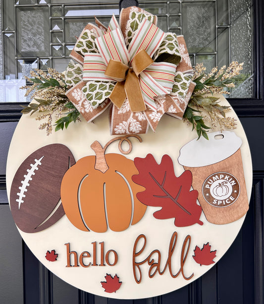 Handmade Hello Fall birchwood door hanger with football, pumpkin, red leaf, pumpkin spice cup, greenery, and layered bow on a black front door