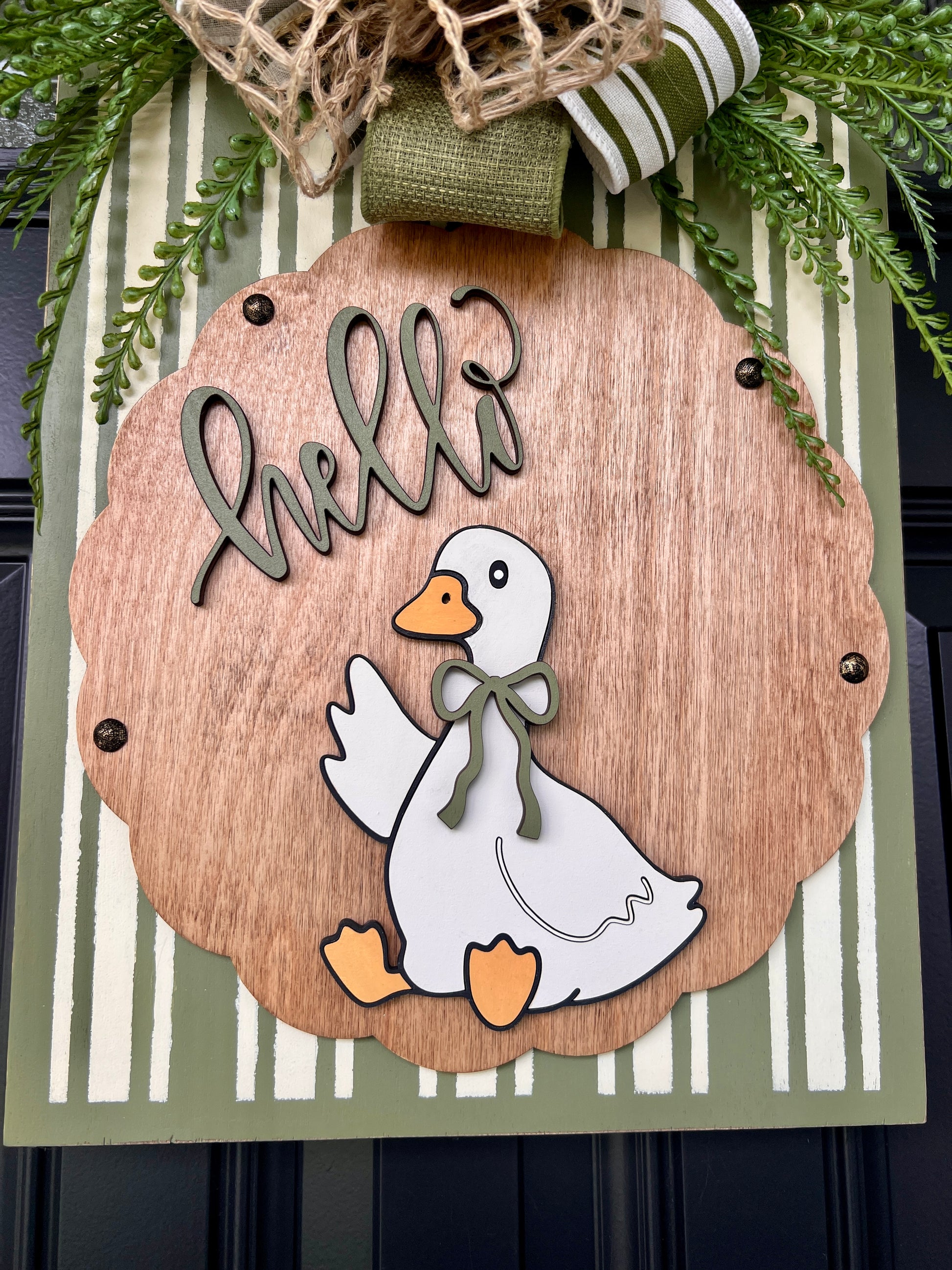 Hello Goose door sign angled view showing depth of 3D lettering and layered bow detail