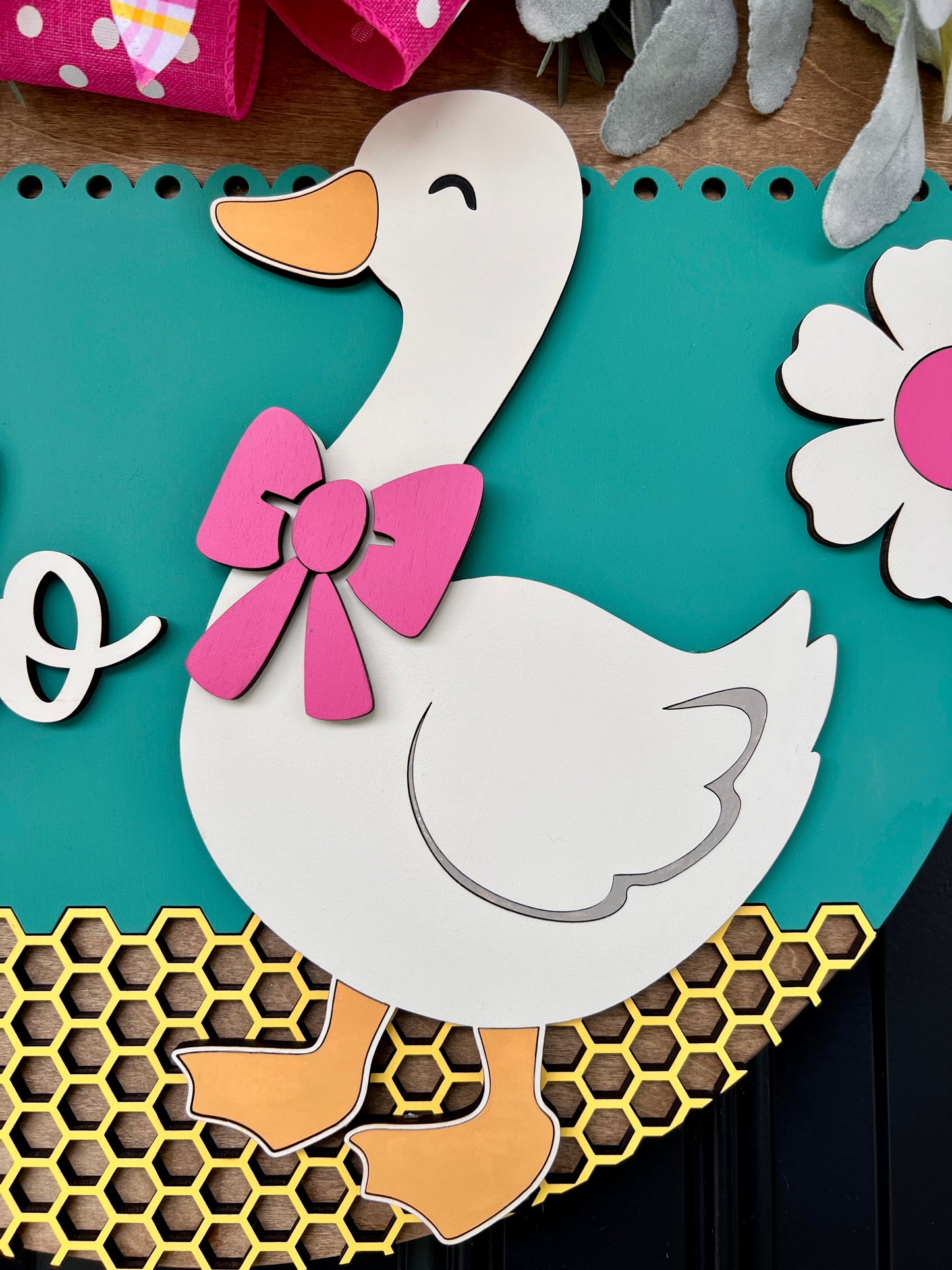 Hello Goose door hanger showing honeycomb laser cut base detail