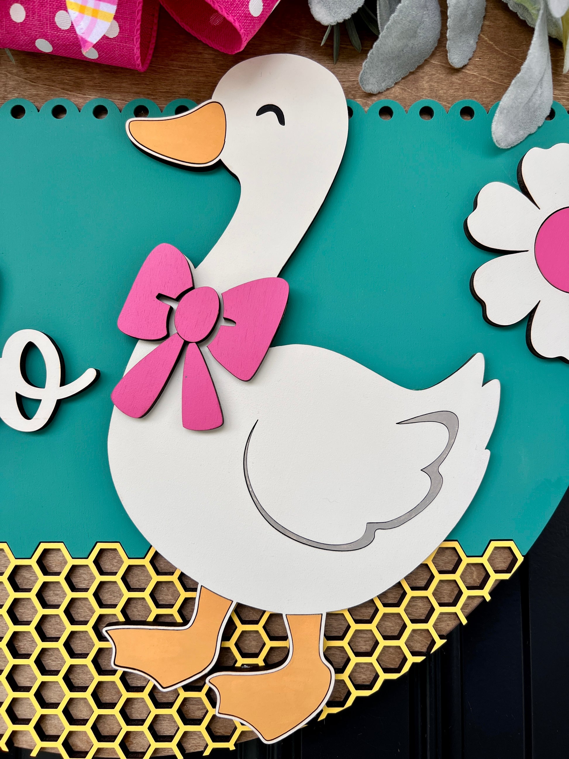 Hello Goose door hanger showing honeycomb laser cut base detail