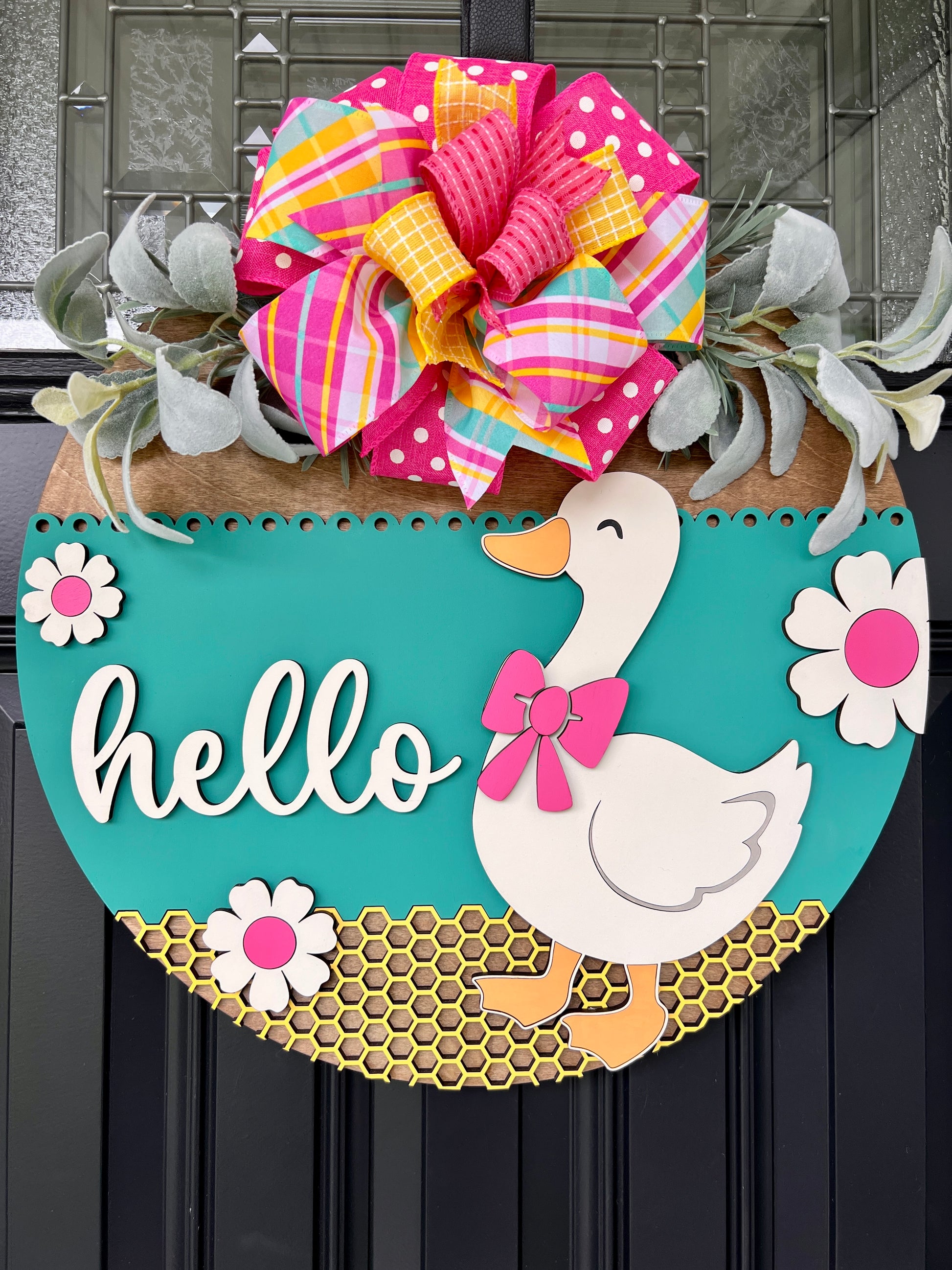 Hello Goose teal birchwood door hanger lifestyle shot on front door