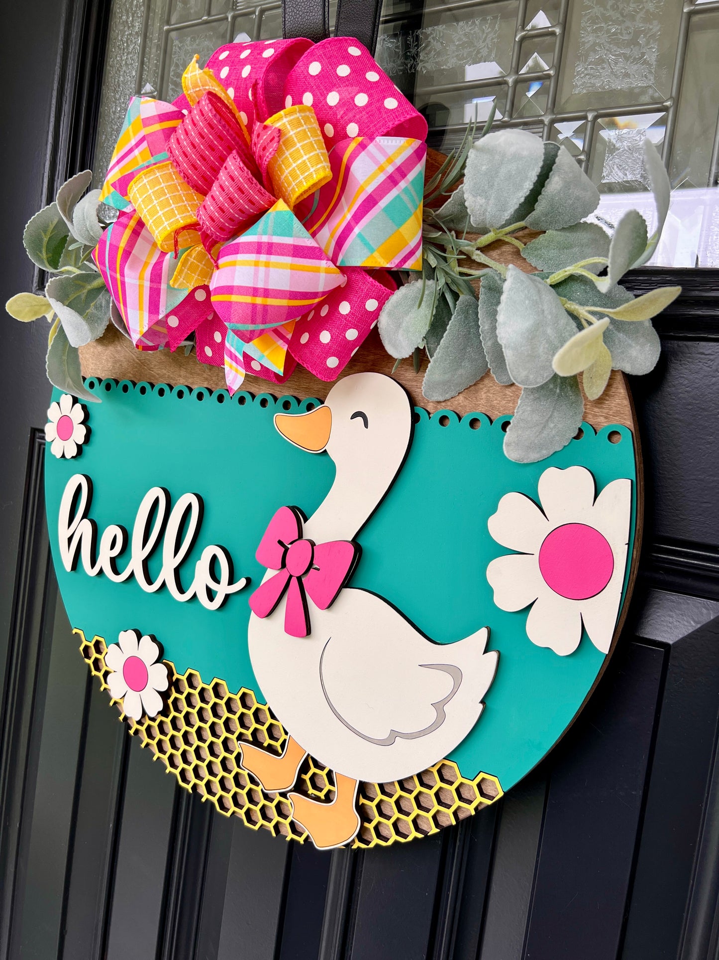 Hello Goose door hanger full view showing teal background with white goose and pink bow