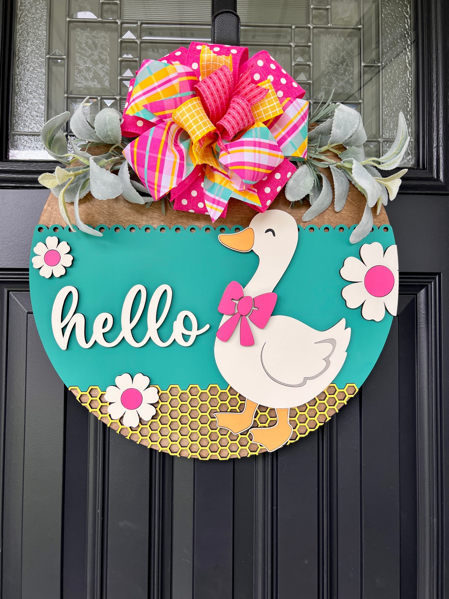 Hello Goose spring door hanger close up of bow detail with hot pink polka dot and multicolor plaid ribbons