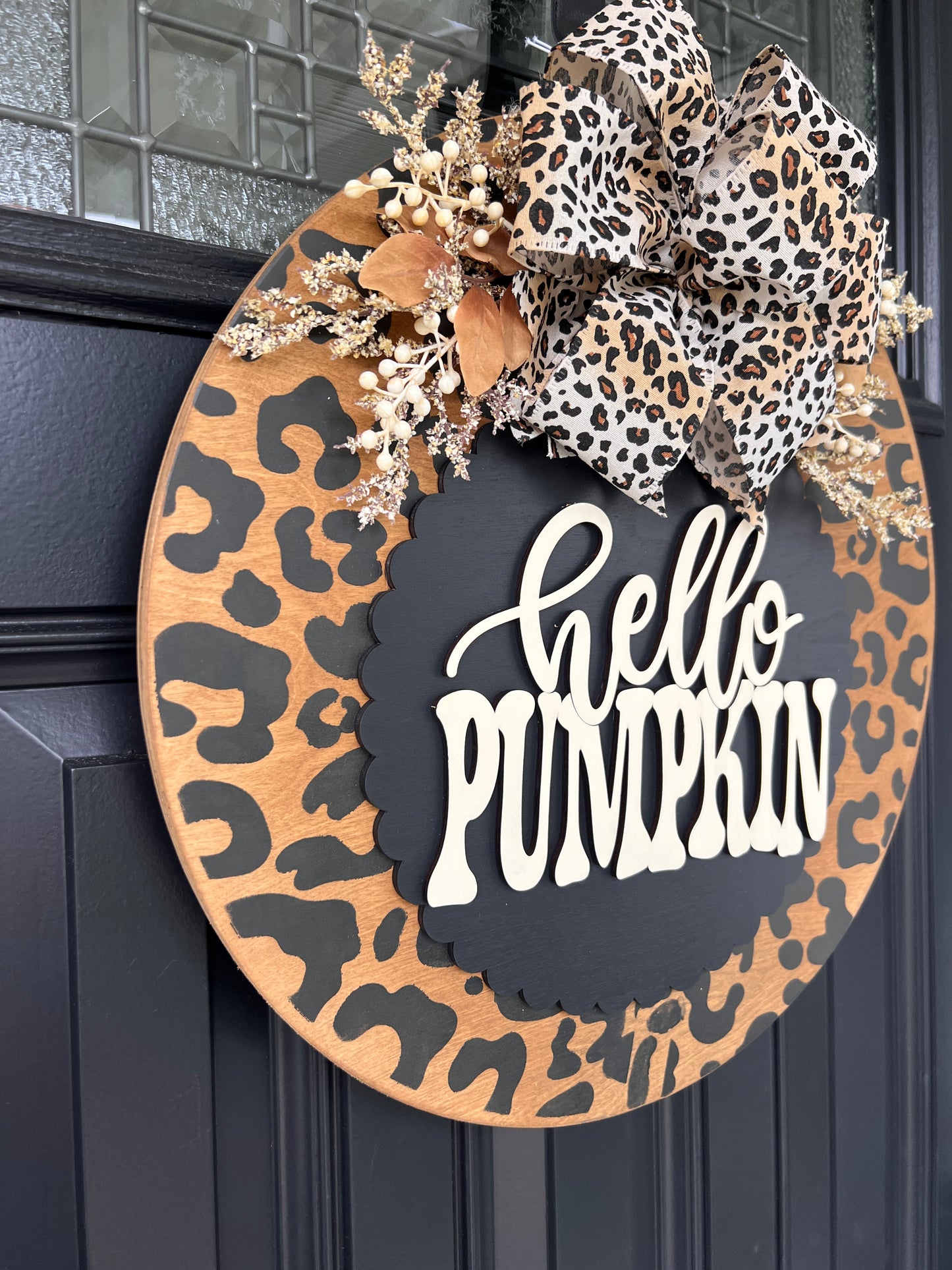 Hello Pumpkin leopard print door hanger side angle showing bow detail with gold dried botanicals