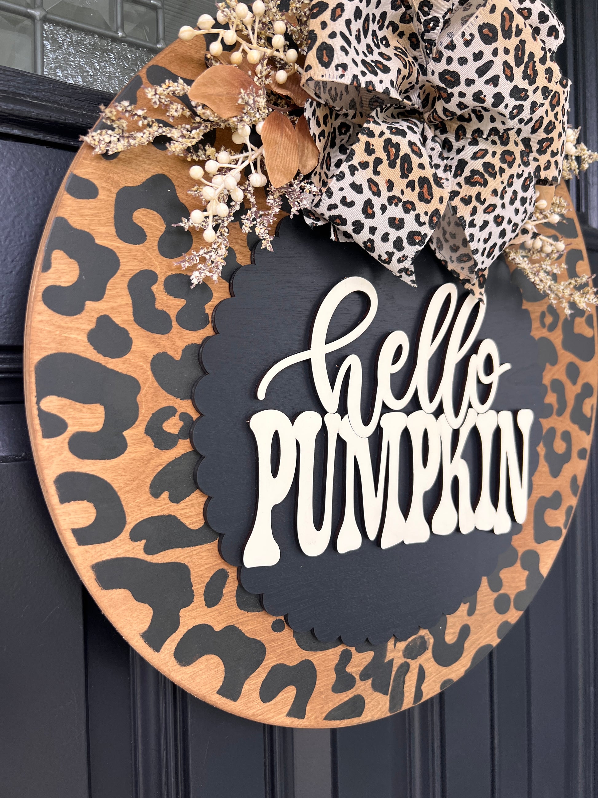 Hello Pumpkin leopard door hanger close up of bow with cream berries and warm gold accents