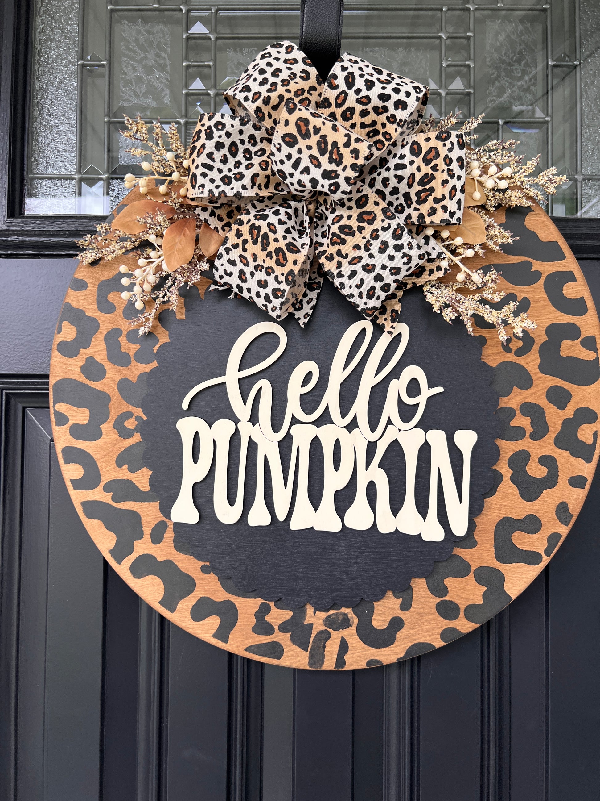Hello Pumpkin leopard fall door hanger detail showing natural wood leopard border and scalloped center