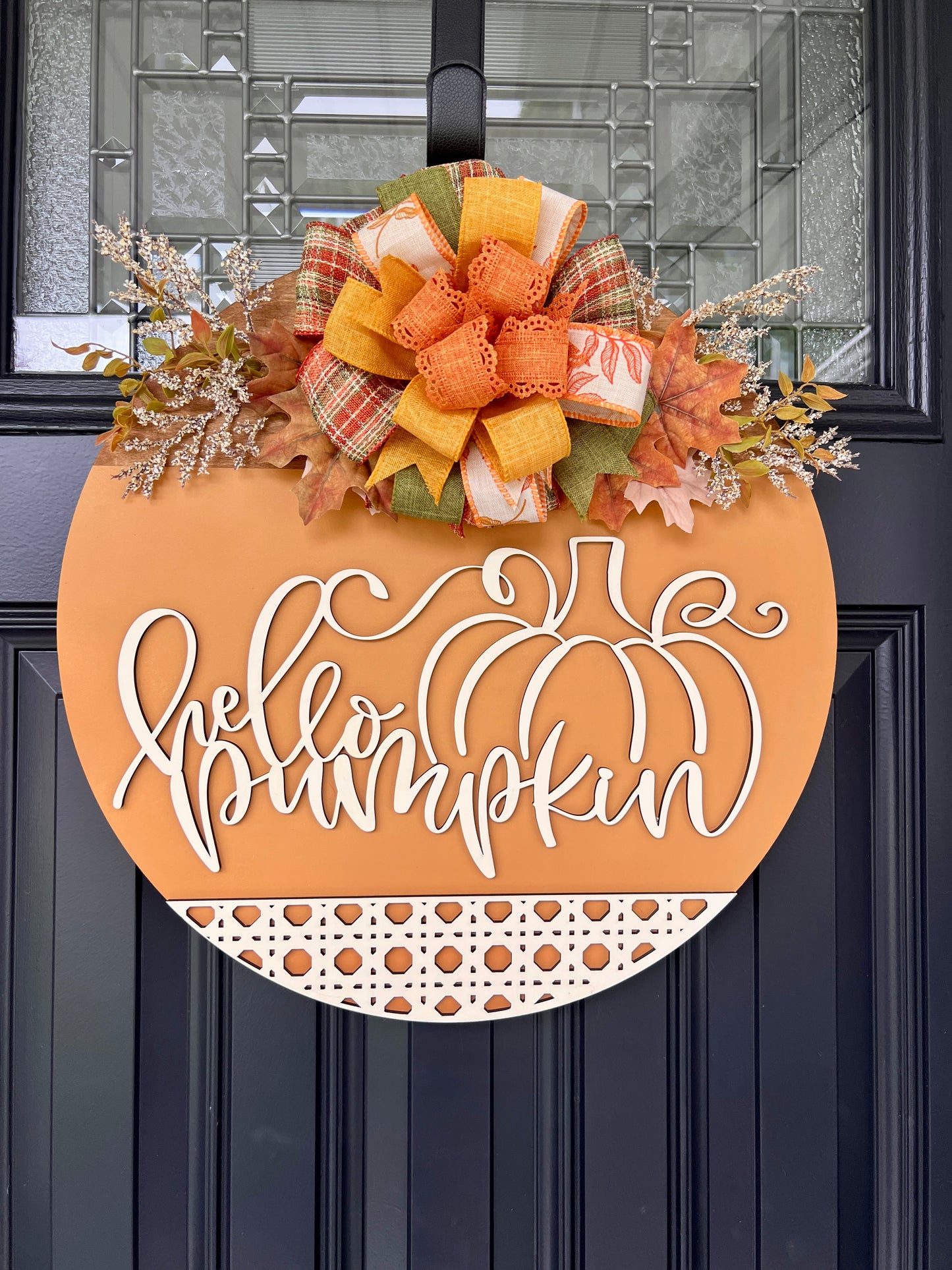 Hello Pumpkin door hanger detail showing script lettering and pumpkin cutout
