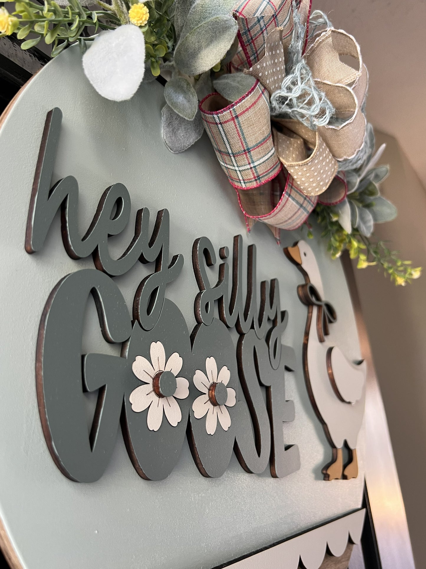 hey silly goose door hanger farmhouse decor
goose front door sign spring wooden door hanger
handmade goose wreath neutral farmhouse decor
cute goose sign front porch decor wood sign
layered wood goose door hanger with bow greenery