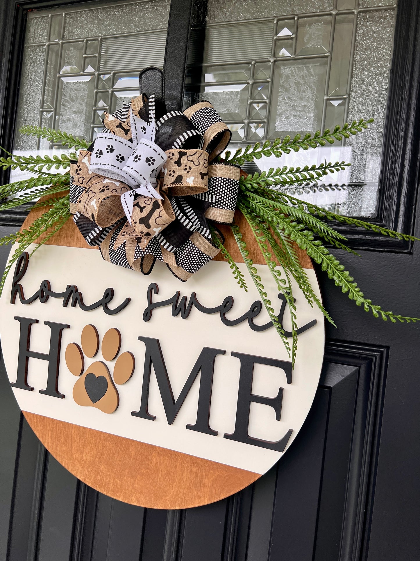 Home Sweet Home two-tone birchwood door hanger with cream and natural wood panels on black door