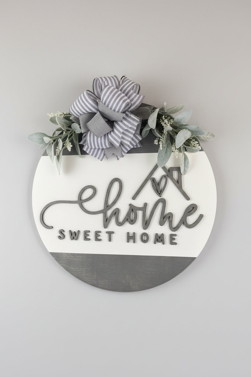 Decorative wreath with 'home sweet home' sign and floral elements on a door.