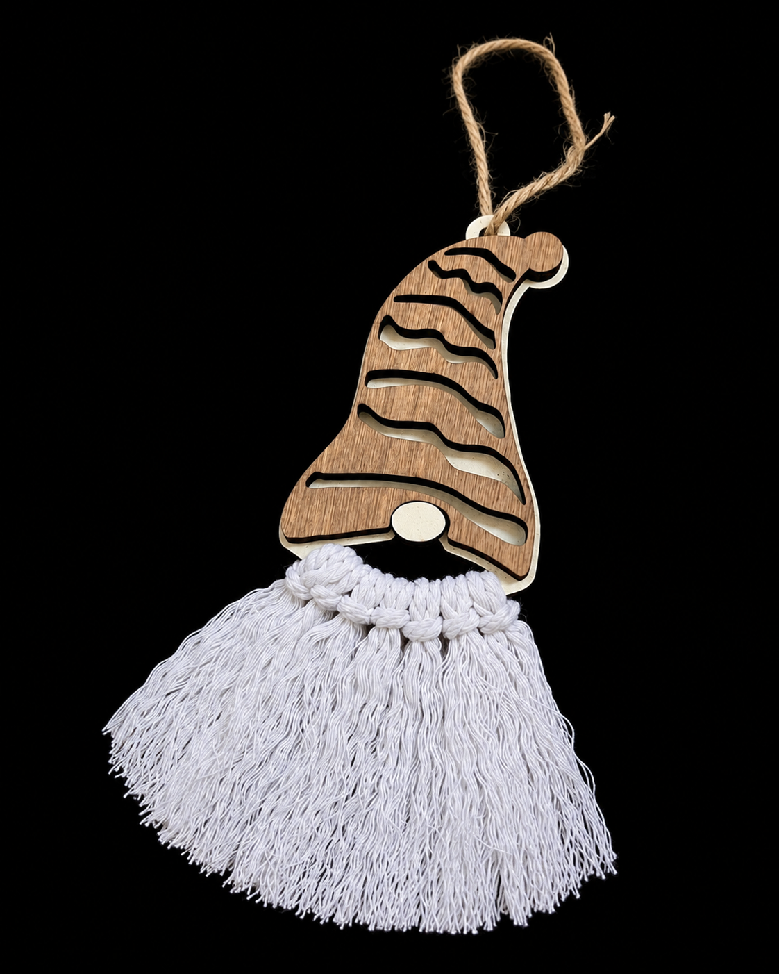 Wood gnome Christmas ornament on black background showing detail