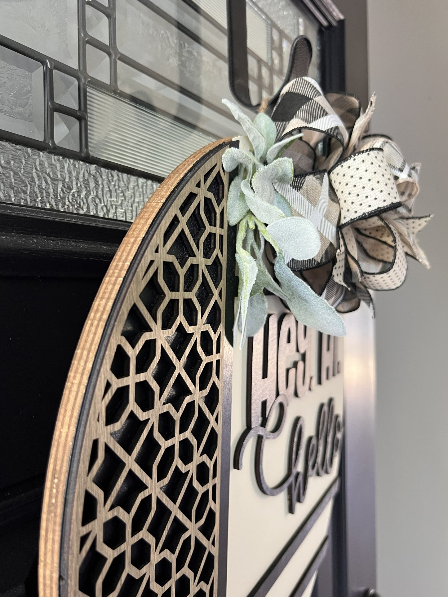 Decorative birchwood wreath with floral elements on a door- Hey Hi Hello 