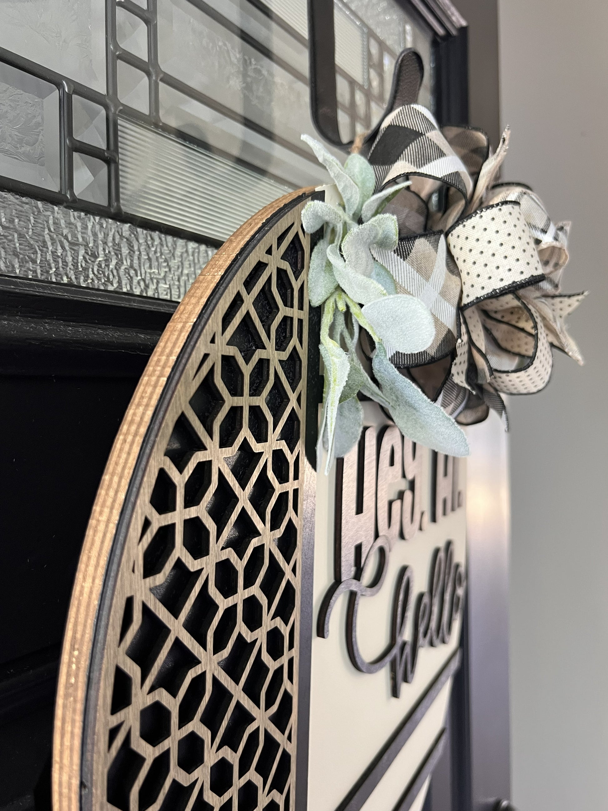 Decorative birchwood wreath with floral elements on a door- Hey Hi Hello 