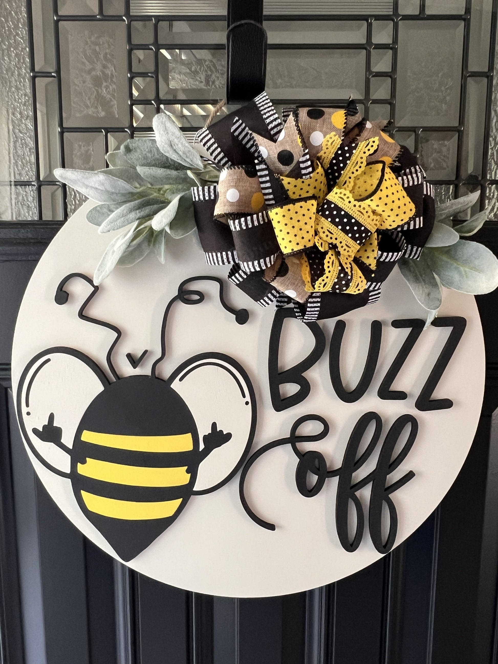 “Buzz Off bee door hanger black yellow farmhouse front door decor”
“Funny bee sign handmade wooden door hanger with bow greenery”
“Bee themed front door decor round wood sign farmhouse style”