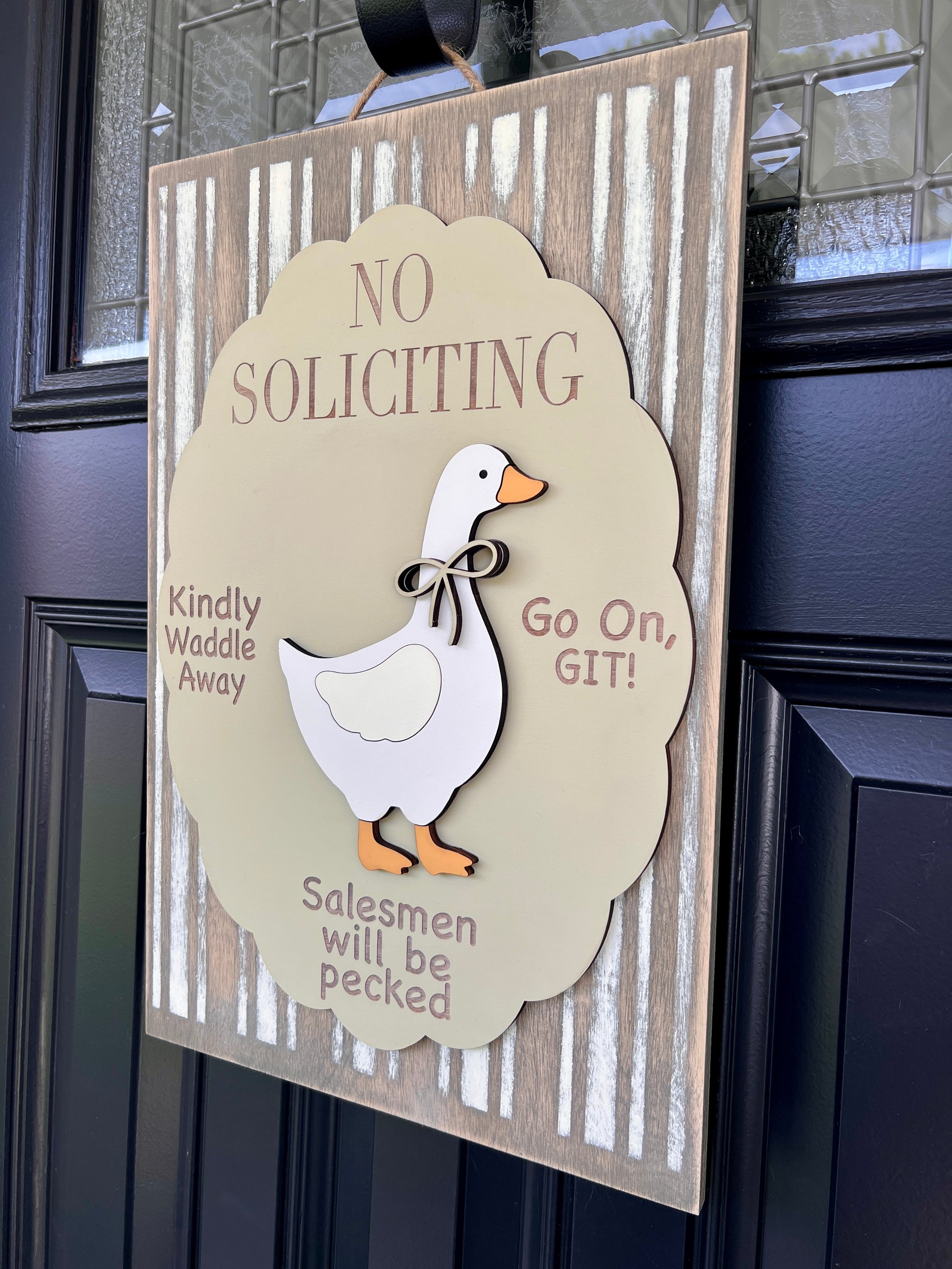 No Soliciting goose sign close up showing 3D white goose with twine bow tie on sage scalloped oval