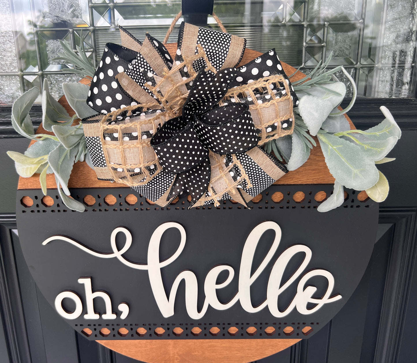 Oh hello door hanger close up of bow showing black polka dot open weave burlap and black dot mesh ribbons with lambs ear greenery