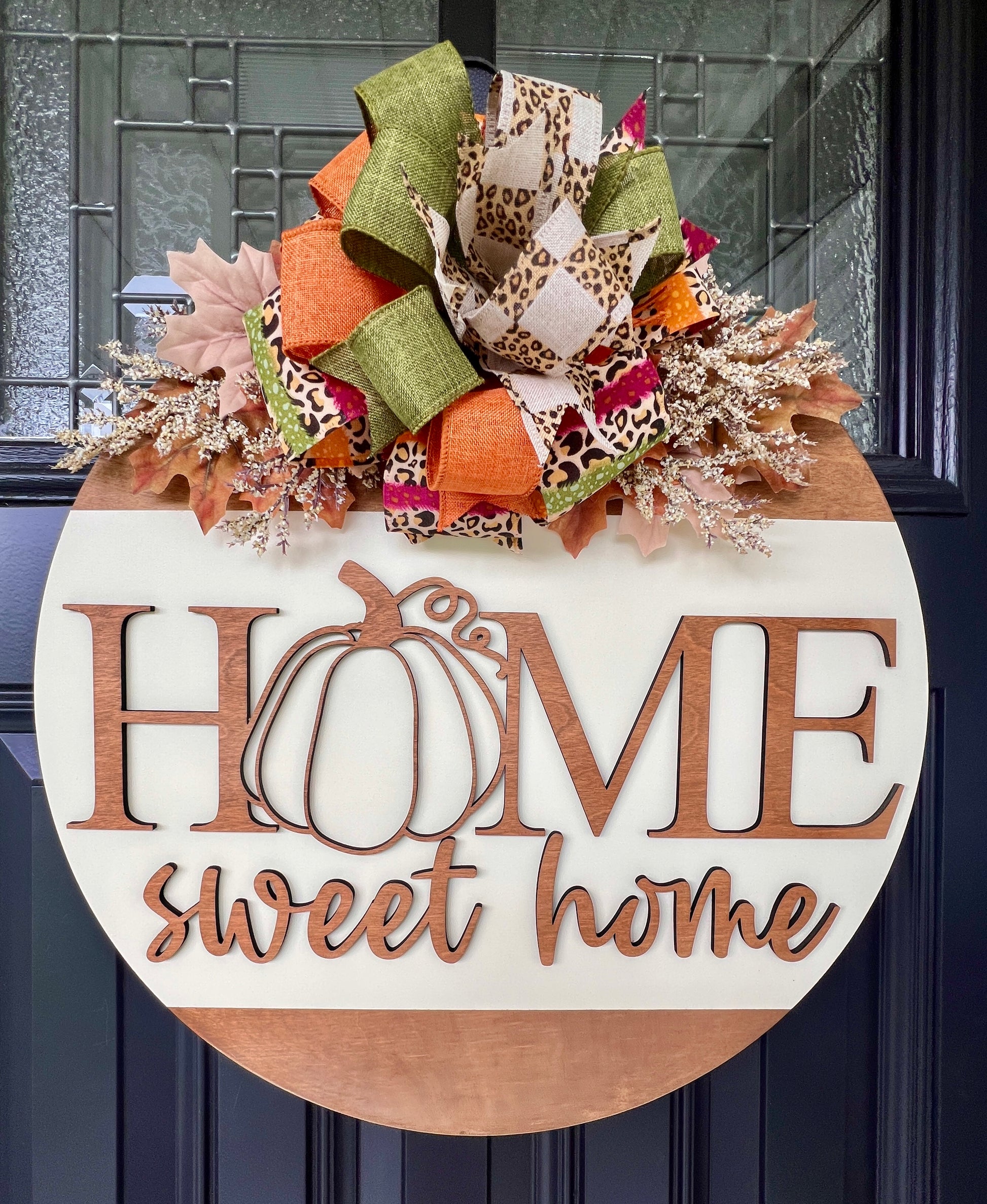 Decorative door hanger with 'Home sweet home' birchwood overlay and colorful bow, Fall florals on a door hanger. 