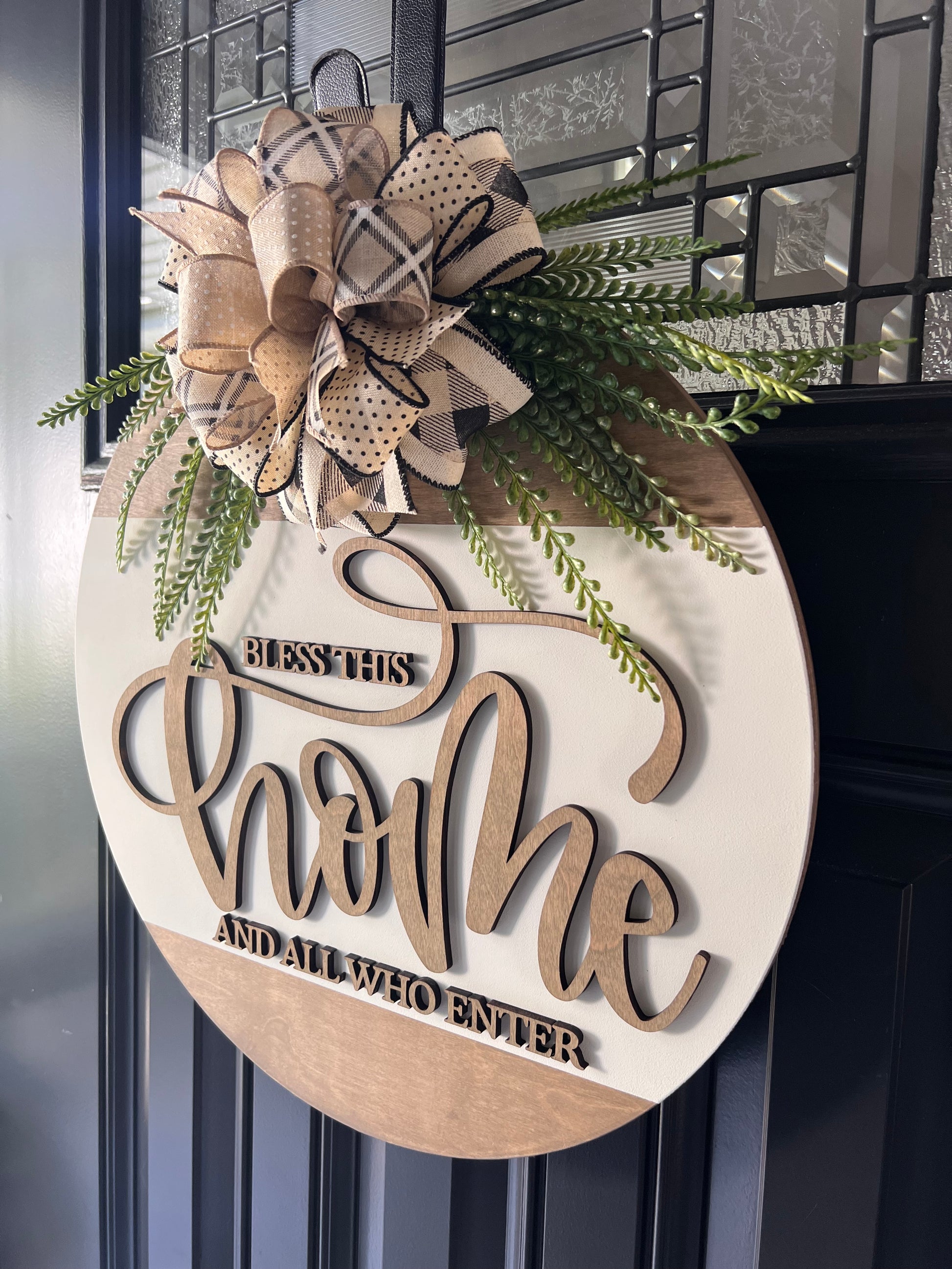 Rustic front door decor sign with greenery and patterned bow detail