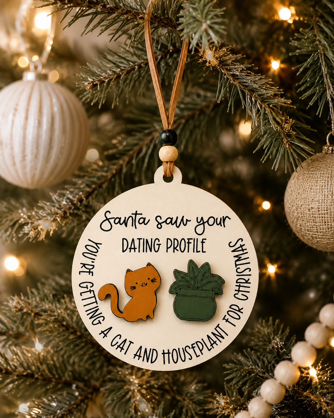 Round Santa Saw Your Dating Profile ornament hanging on a decorated mantel