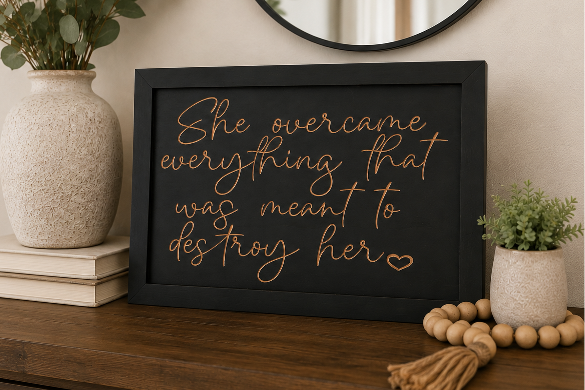 She Overcame Everything wood sign displayed on dresser with home decor