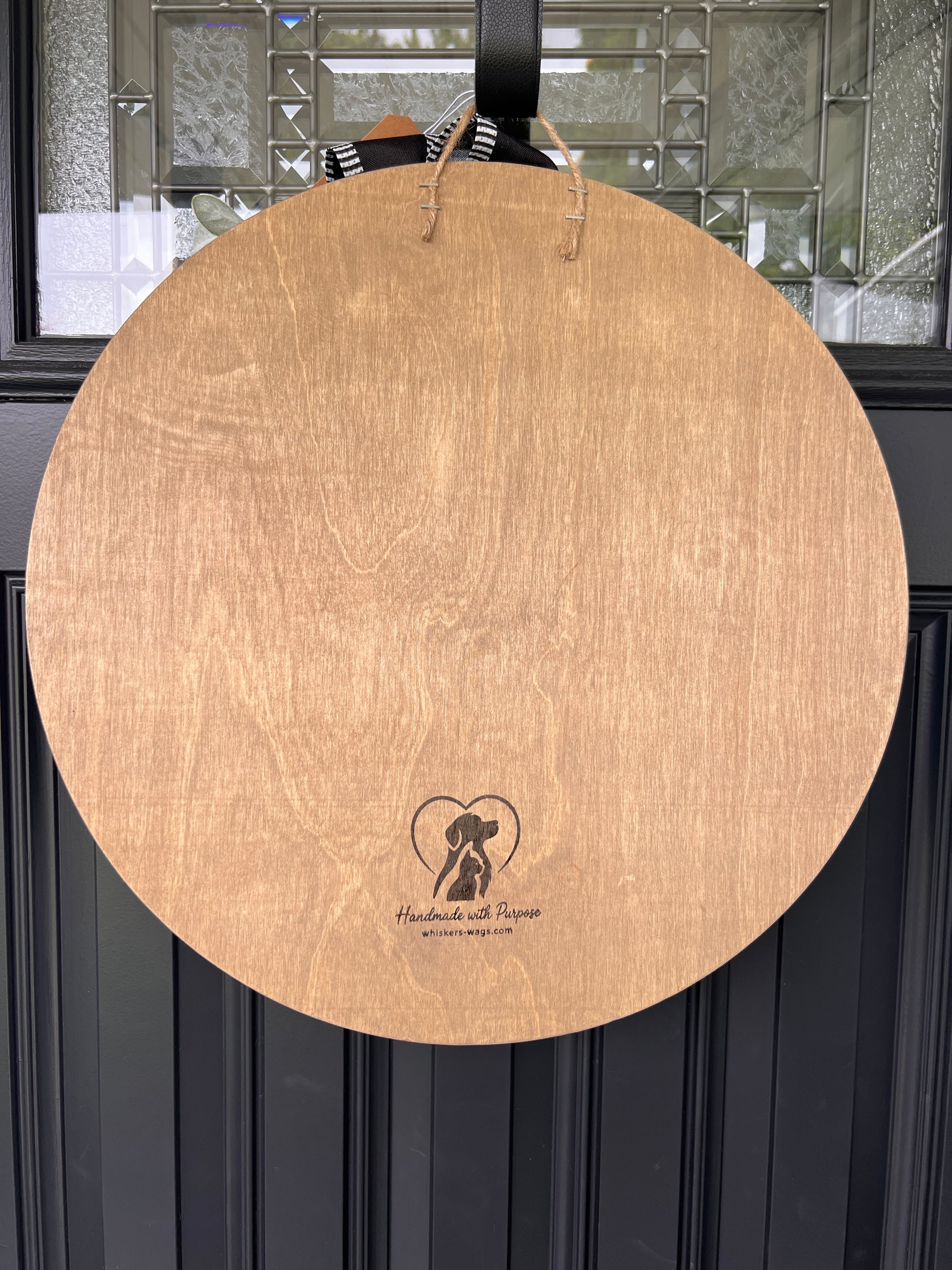 Back of The Cat is in Charge door hanger showing natural birchwood with Handmade with Purpose branding and whiskers-wags.com