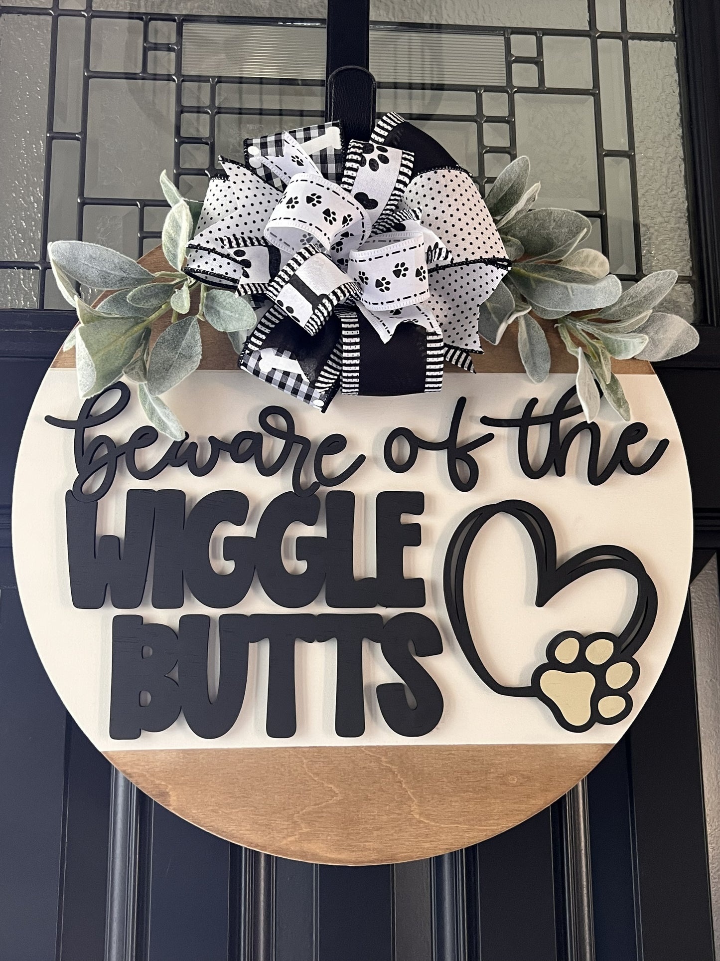 funny dog lover front door sign with black 3-d raised lettering and paw design