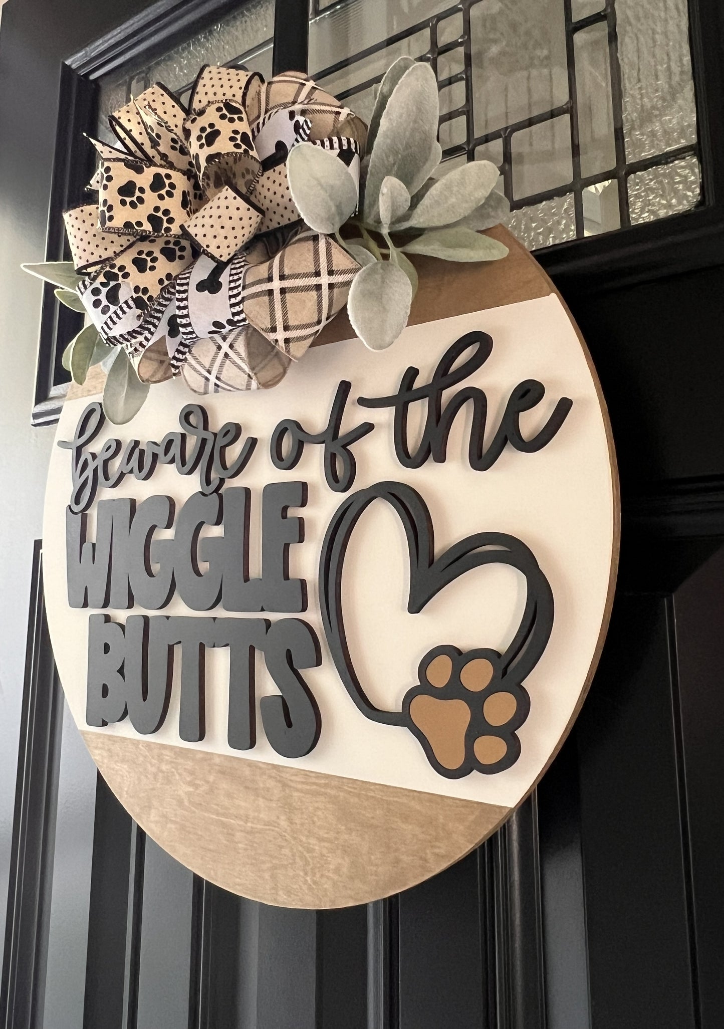 Decorative sign with text 'Beware of the Wiggle Butts' on a door- Dog Lover 